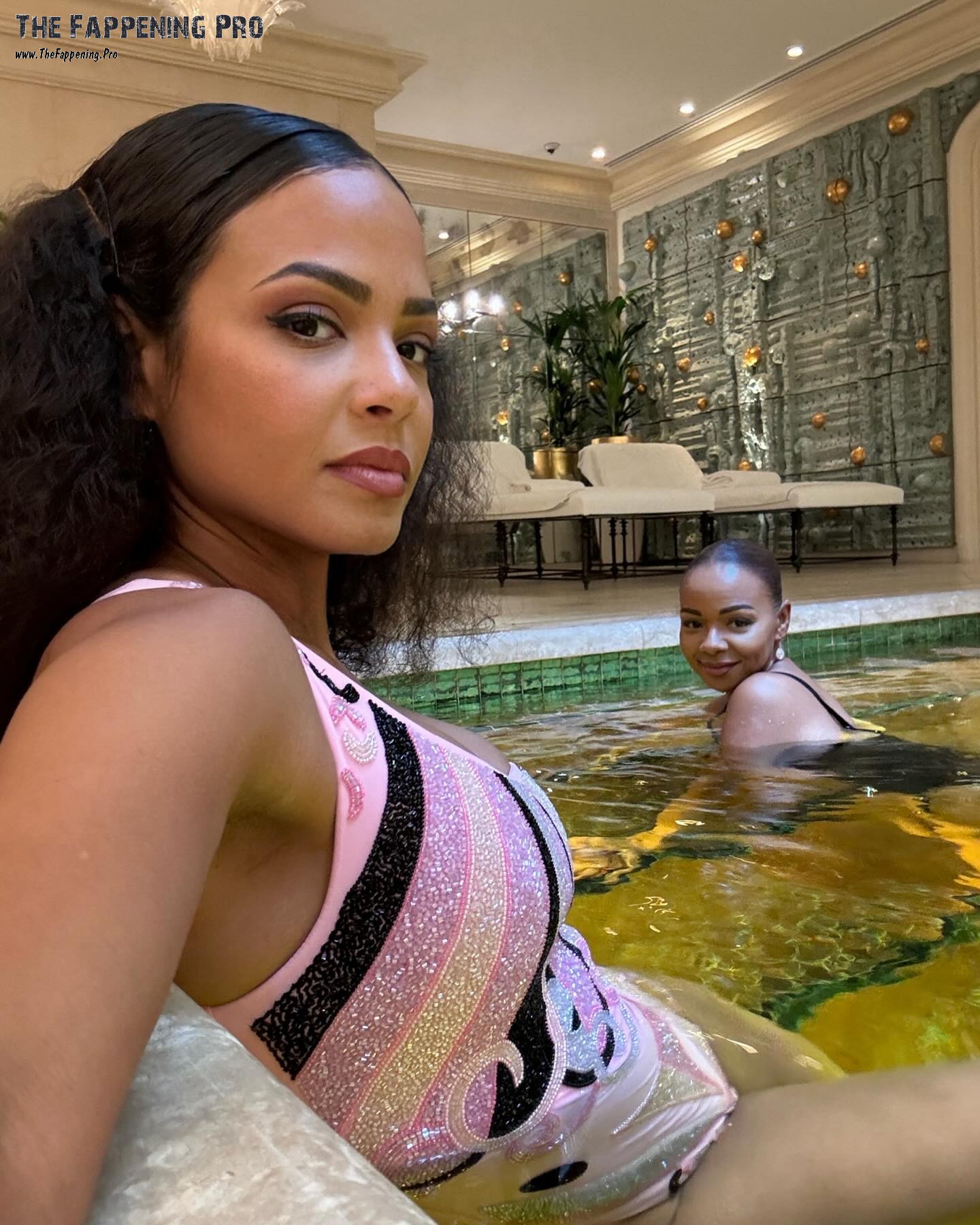 Embark on a journey with Christina Milian as she tantalizes fans with jaw-dropping bikini photos from a glamorous golden pool. While the shots may seem promotional, Christina is simply living her best life on vacation at the luxurious Hôtel de Crillon. At 42 years young, the Jersey singer is stunning in her swimsuit, offering fans a peek into her New Year's celebrations. Get ready to be captivated by Christina Milian's sexy bikini photos, sure to leave you craving for more!