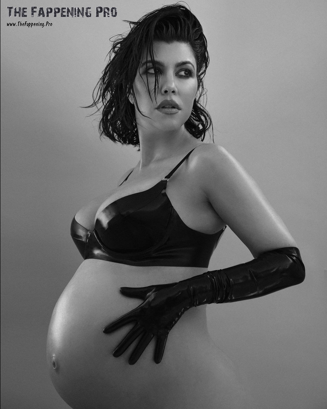 In a shocking turn of events, pregnant Kourtney Kardashian bared it all for a photoshoot with Vanity Fair Italy. The reality star posed without panties, rocked mesh tights, and even went topless, covering her breasts with her hands. The scandalous BTS footage is set to be released soon, leaving fans buzzing with anticipation. Follow Kourtney's daring maternity journey on her social media platforms.