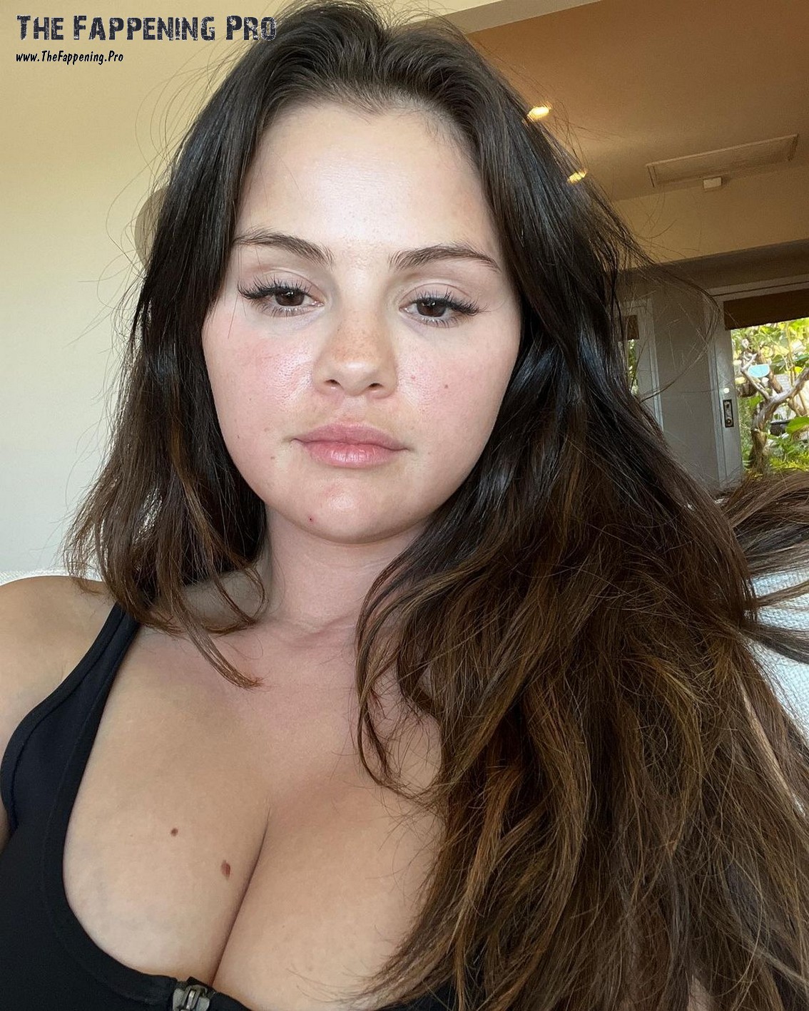 Get ready to be blown away by Selena Gomez's latest selfies! The pop star is flaunting her curves in a see-through white tank top and a revealing bikini, showing off her noticeably larger assets compared to a leaked photo from just a year ago. Fans are buzzing about Selena's transformation and you won't want to miss out on all the juicy details!