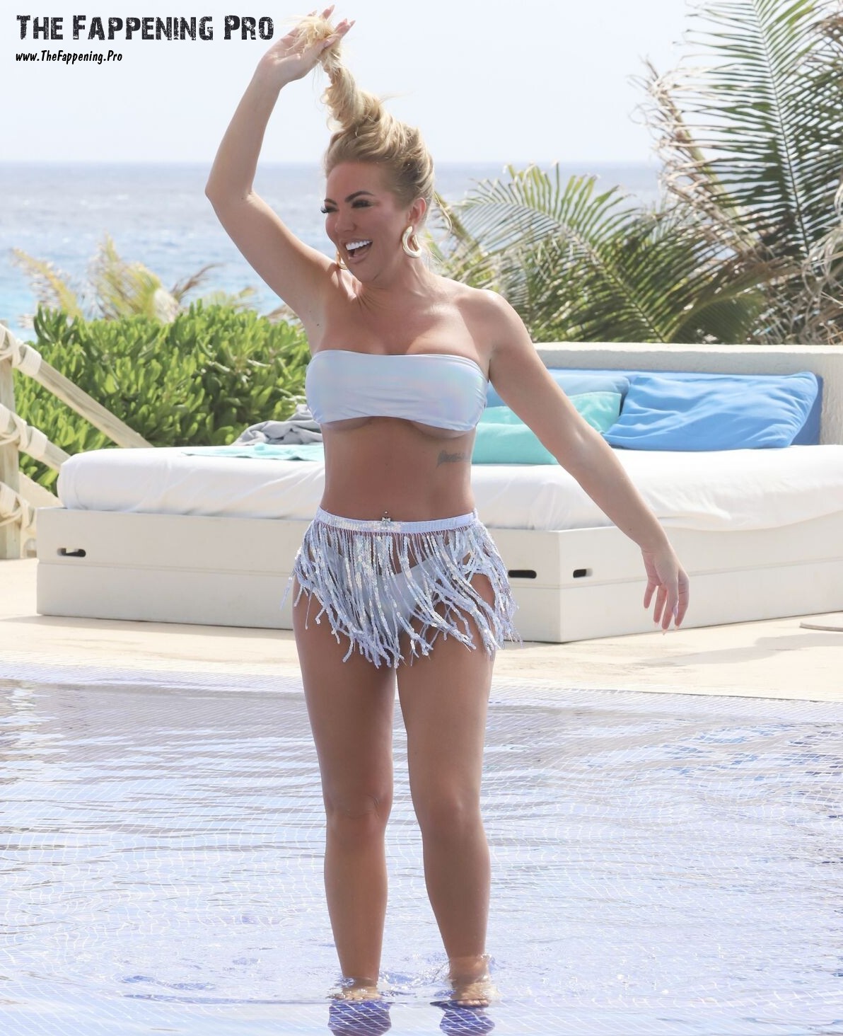 Get ready for some serious poolside glamour as British TV star Aisleyne Horgan-Wallace sizzles in a barely-there bikini in Cancun, Mexico. Paparazzi shots captured her stunning figure and left fans in awe. Don't miss out on this hot and daring look that has everyone talking!